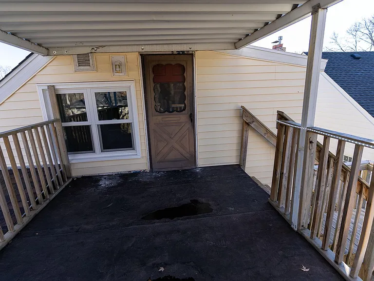Deck and separate entrance to upper living space with 1 bed, 1 bath, kitchen, living room.