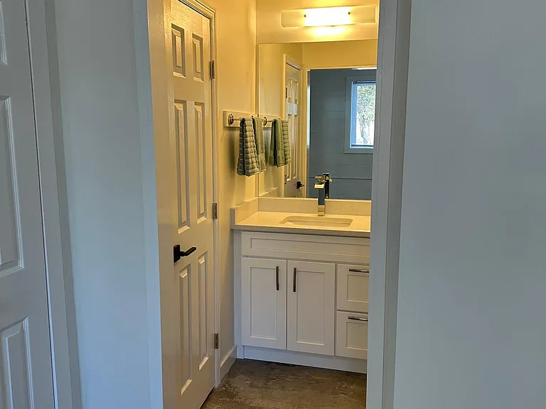 Vanity off of Den/Office (Toilet to left, Bath & Shower to right), 6'7" x 3'4"...