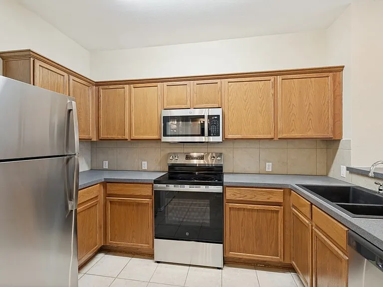 Corian countertops and recently installed stainless appliances.