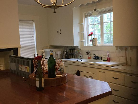 Kitchen island with sink in rear