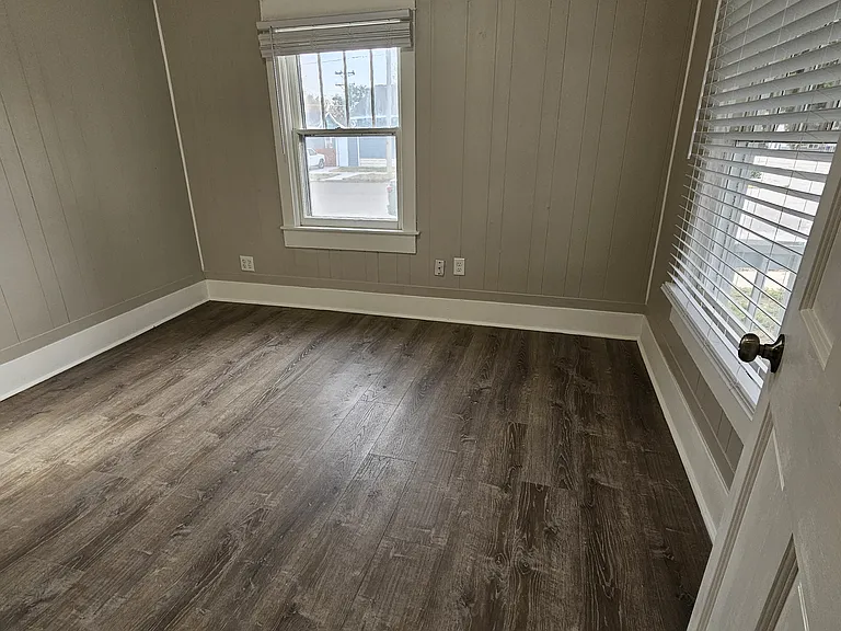 Front Bedroom 11' 6" x 10' with ceiling fan.
