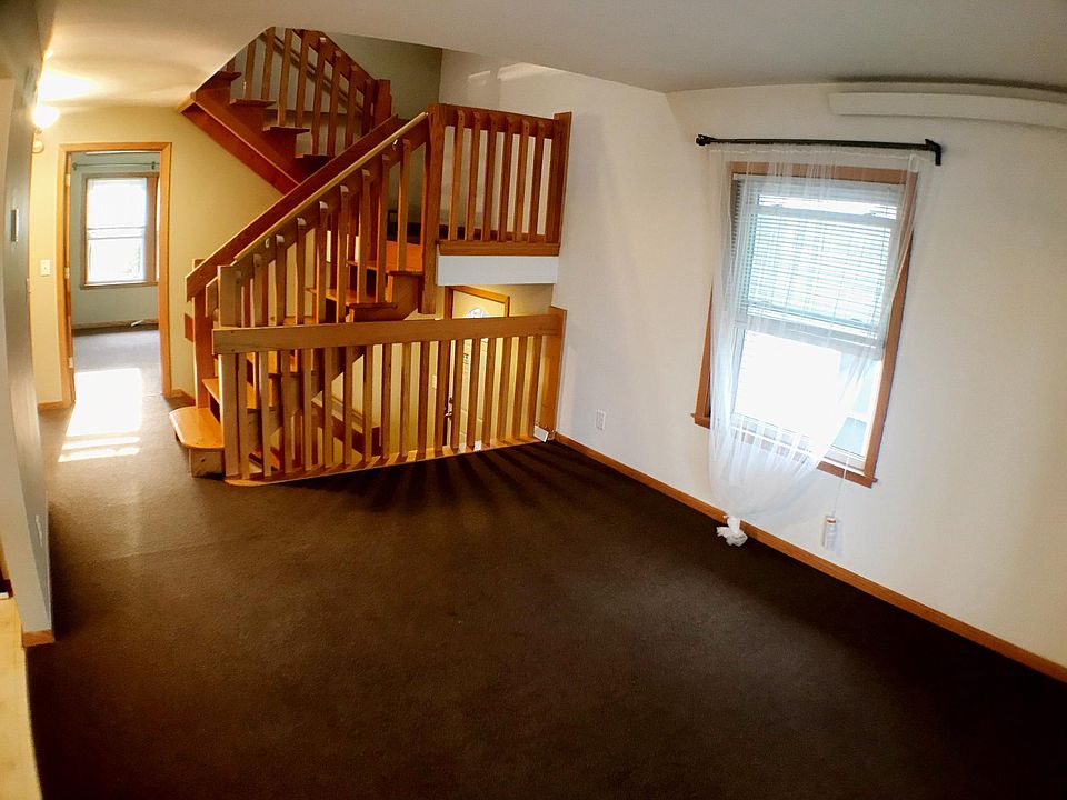 Large living room with two bedrooms opposite