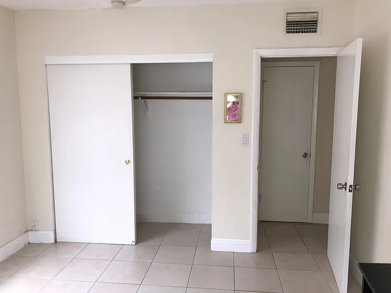 view of another closet and doorway to hallway