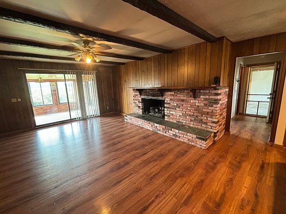 Family room, doorway to all seasons room, gas fireplace,