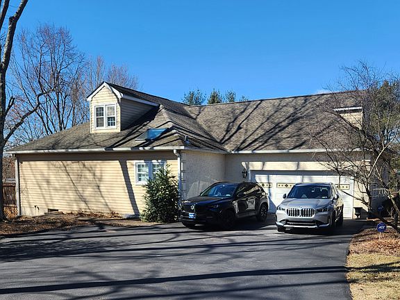 2 car Garage with parking to the left side. Paver walkway to back deck.