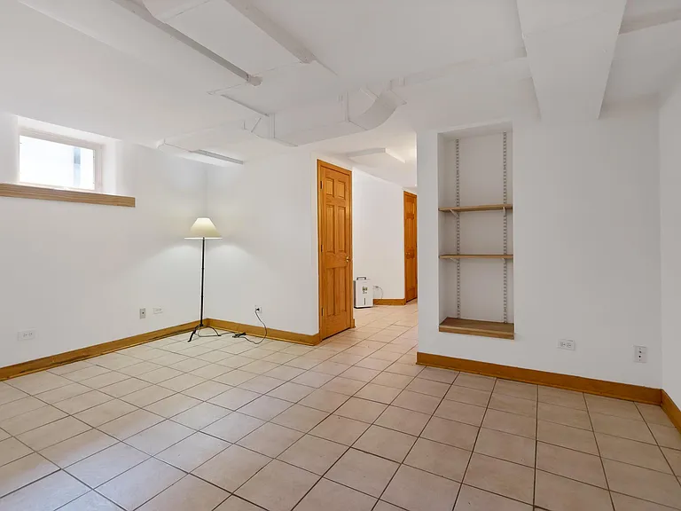 Family Room, Media Room or just hang-out area. Built in shelves. Exposed ducts for a contemporary loft look. Wood trim and doors throughout.