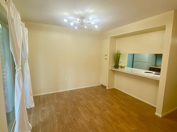 Dining area with bar to kitchen pass through and second full storage pantry.