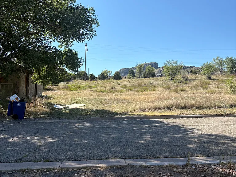 Beautiful land across the street with old adobe building for storage