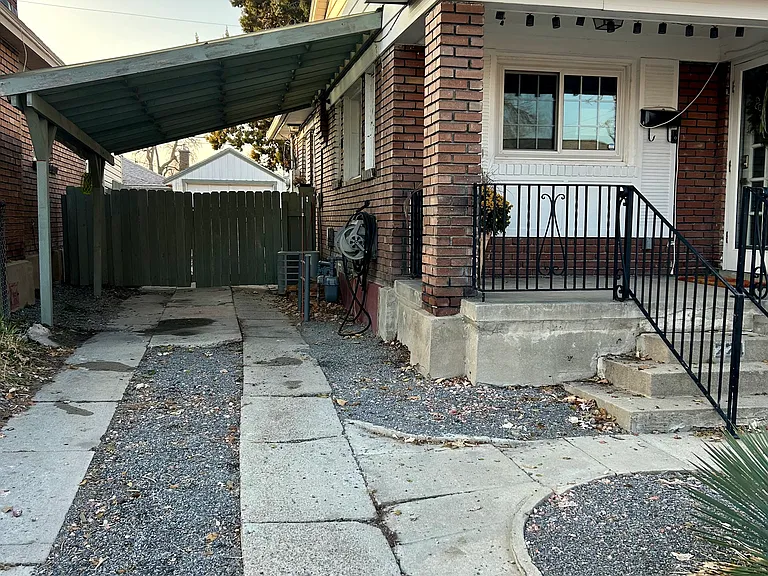 Driveway on left sideof house. Can park two cars easily.