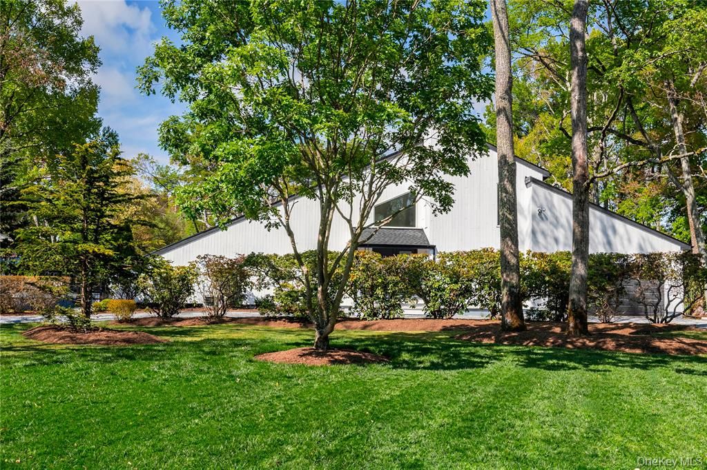  On 1 acre of meticulously kept parklike grounds