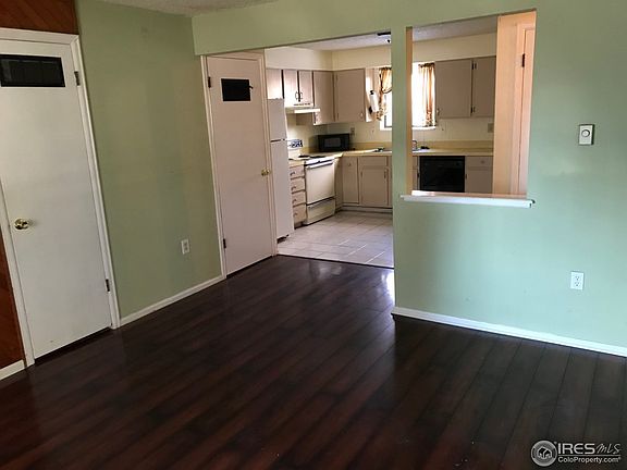 Laminate wood flooring in open concept living room