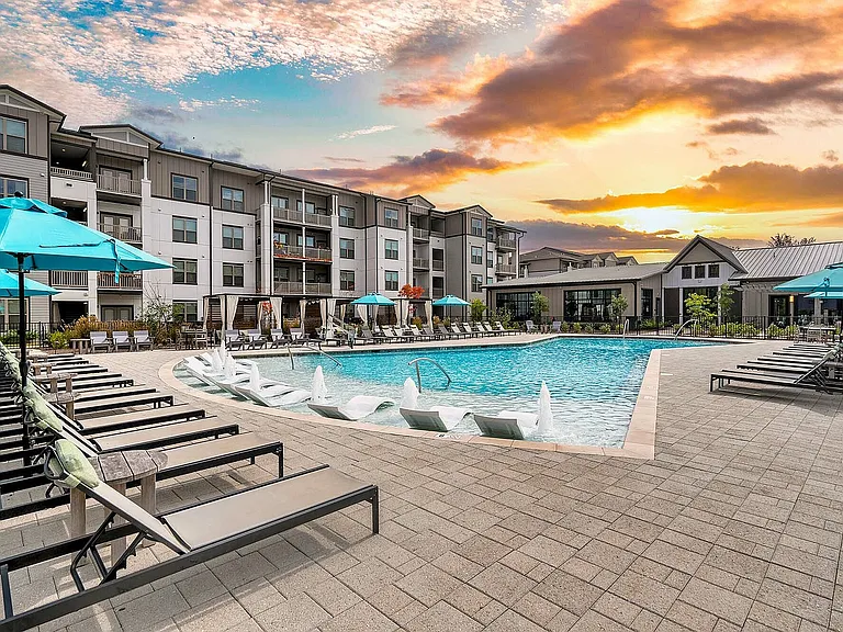 Experience the ultimate relaxation at this luxury apartment community with stunning pool views.