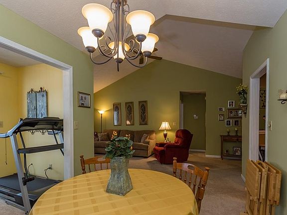 Formal dining area opens to the great room, and the office/sewing room