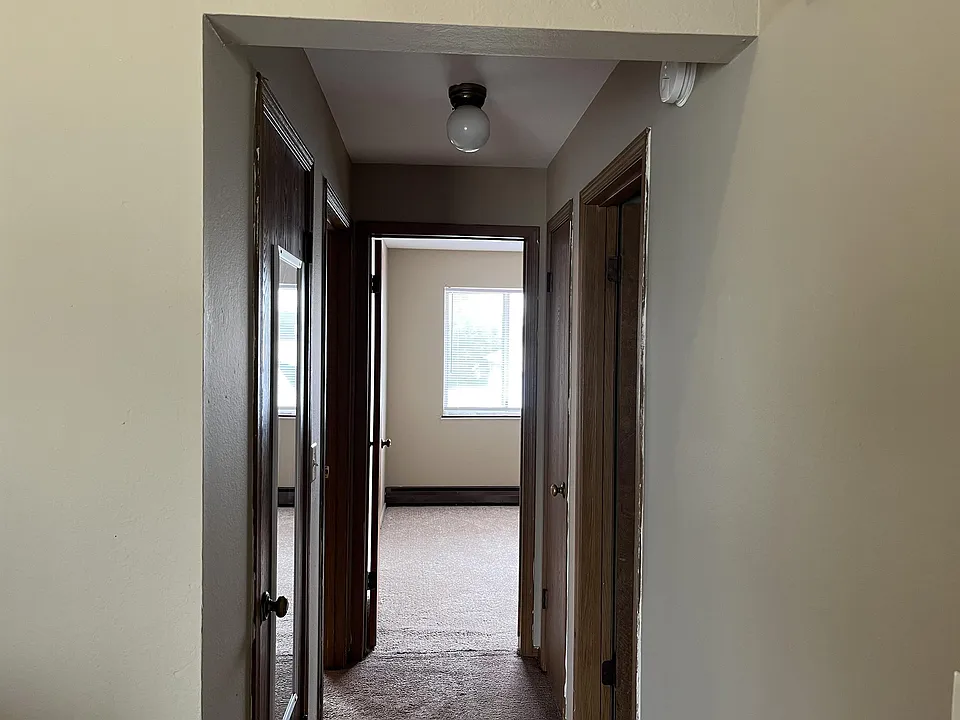 Hallway leading to bedrooms and bathroom