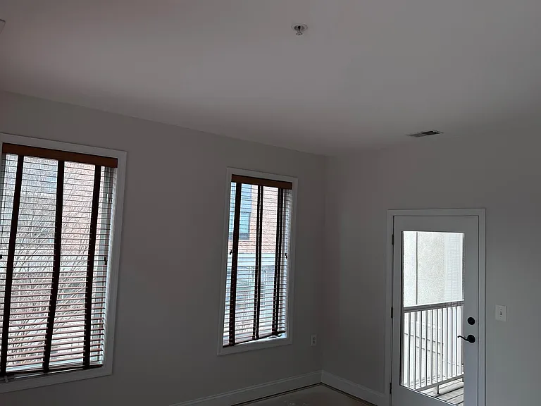 Master Bedroom with 2nd outdoor balcony. Master 13.1 x 13.1. Plenty of room for king bed, 2 end tables, and dresser. 2 of 4 windows showing, a walk-in closet, a completely remodeled primary bath, with huge walk in shower, large vanity, and linen close