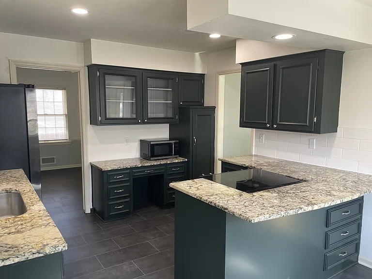 Large kitchen with a lot of counter top space. Dishwasher and refrigerator have been replaced with Black SS.
