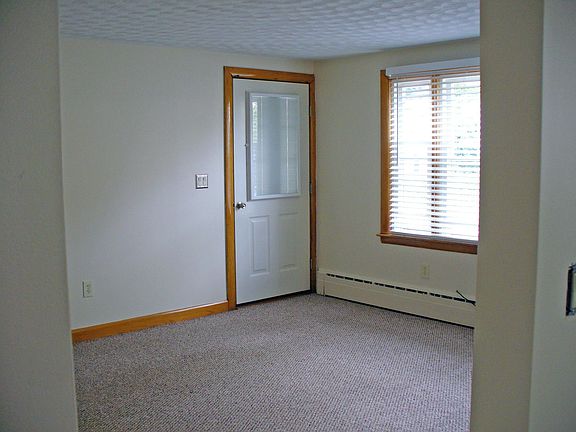 Living Room with custom door and window blinds