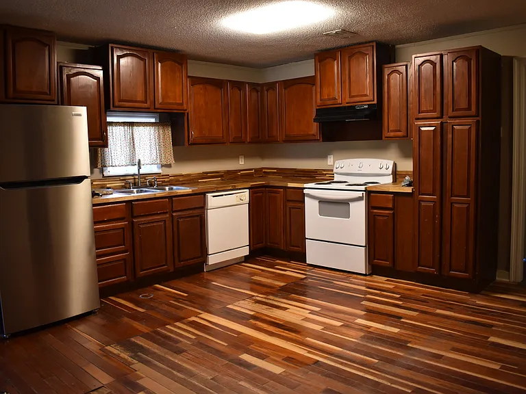 Functional kitchen with plenty of cabinet space and room to cook.