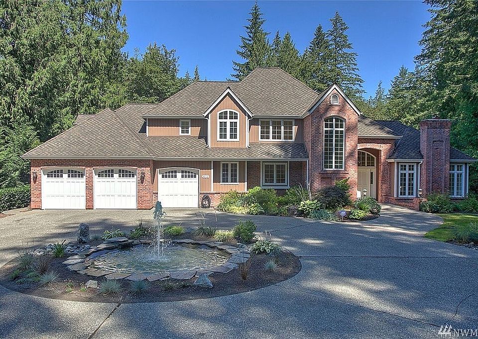 Welcoming circular drive and dramatic water feature invite you in to this beautiful Burnstead home in desirable Tibbett's Station.