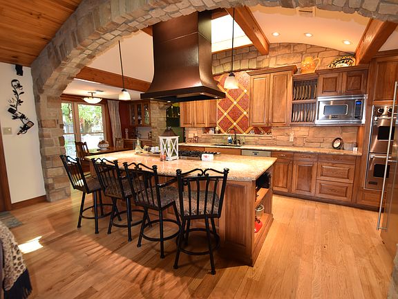 view of kitchen with great lighting looking from living area