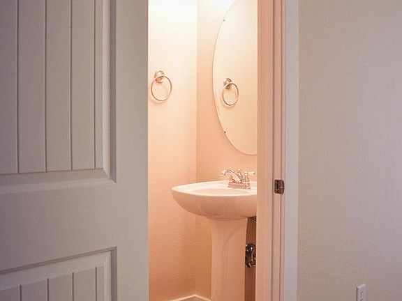 Convenient half bath downstairs off kitchen