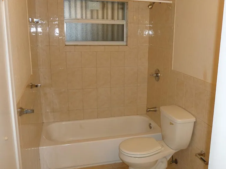 Bath connects to bedrooms and living area