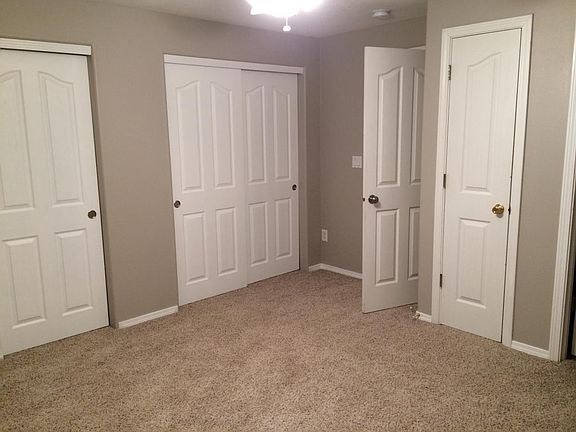 Master bedroom with multiple storage closets