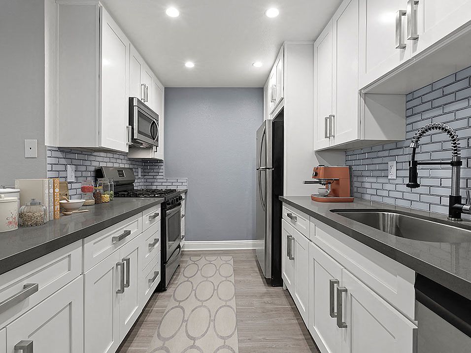 Brand new kitchen cabinets, back splash, quartz stone counter tops, and stainless steel appliances with fridge!