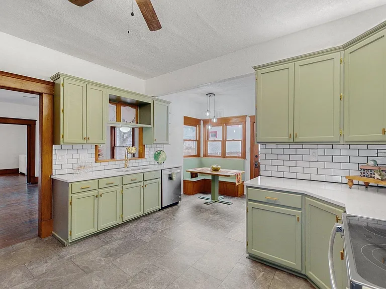 Updated kitchen with LVT, classic subway tile backsplash, appliances approximately 3 years old.