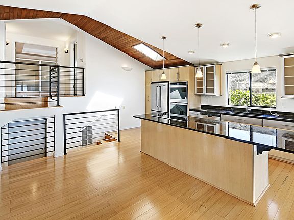 Updated kitchen with granite and stainless appliances.