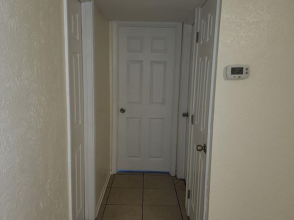 Hallway to Bedrooms Linen closet on right side of hallway