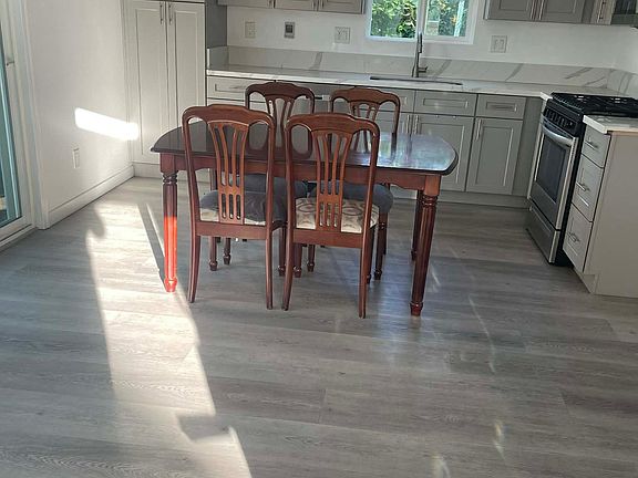 Have your morning coffee (or tea) here in this open kitchen with stainless steel appliances