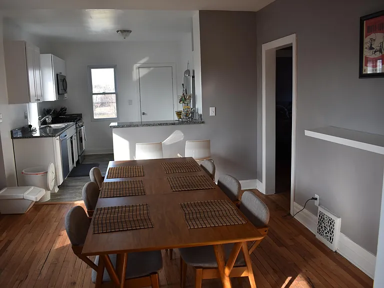 A view from the dining room into the kitchen (please note: f