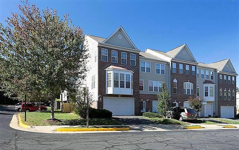 Front Exterior - corner unit with lots of parking on side and behind the house