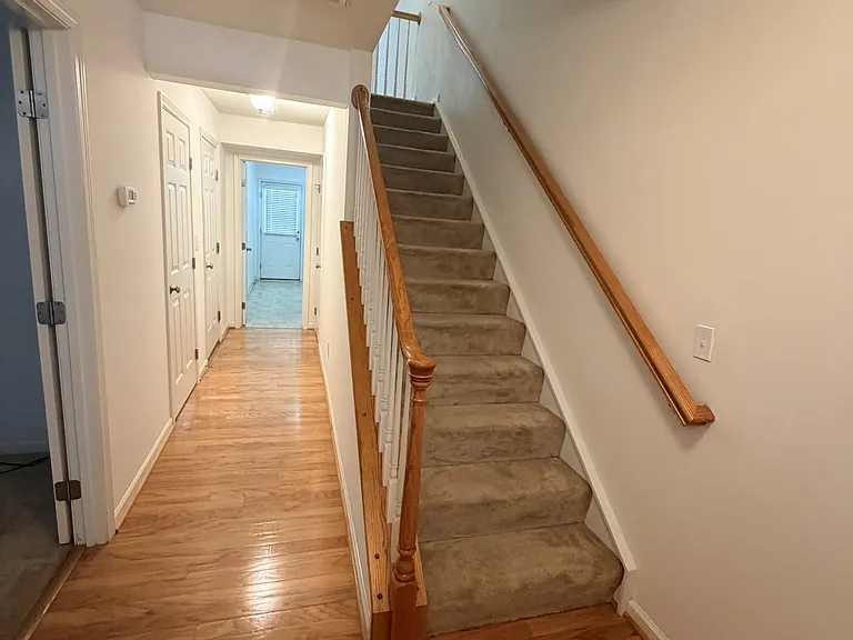 -Hallway to Laundry room.
-Stairs to 2nd Floor. The carpet on stairs will be replaced by hardwood.