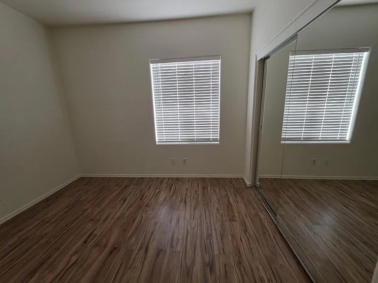 Bedroom #4 with mirror closet doors