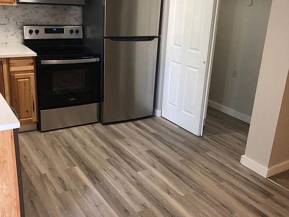New Stove, microwave and refrigerator. Also view of laundry area. New washer and dryer still awaiting delivery