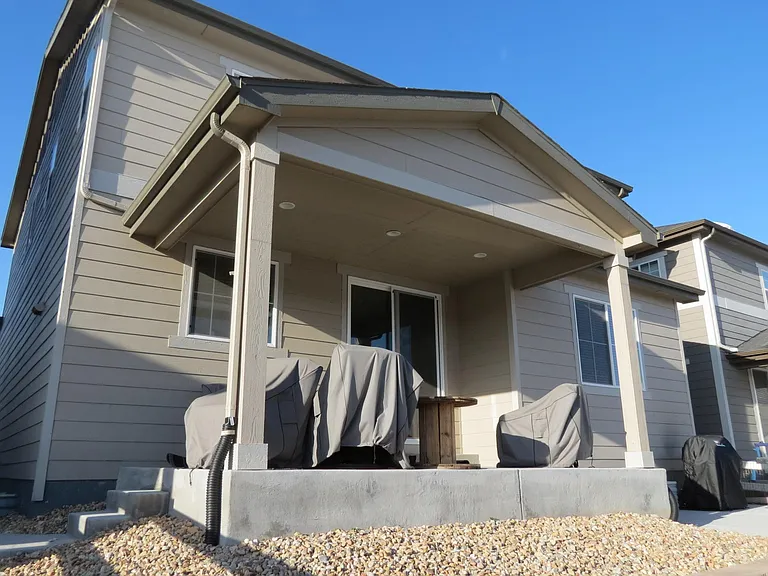 Covered porch for protection from elements and keeps cool in summer.