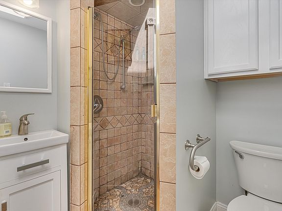 Bathroom, shower, sink and toilet