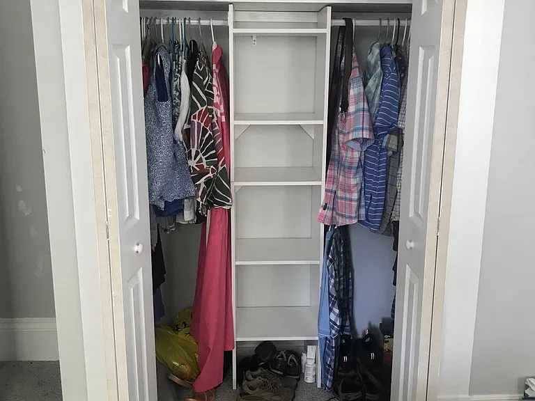 Closet with built in shelves. Bedroom 1