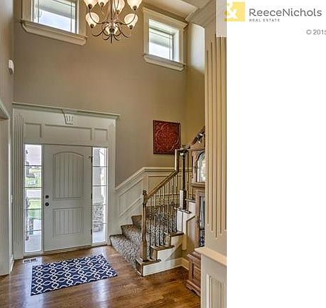 Warm and inviting entry with wood floors