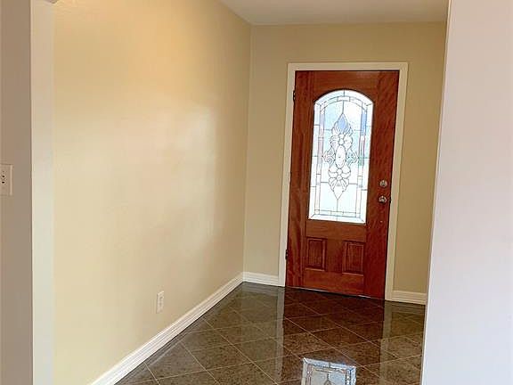 View of entry hallway. Neutral colors.
