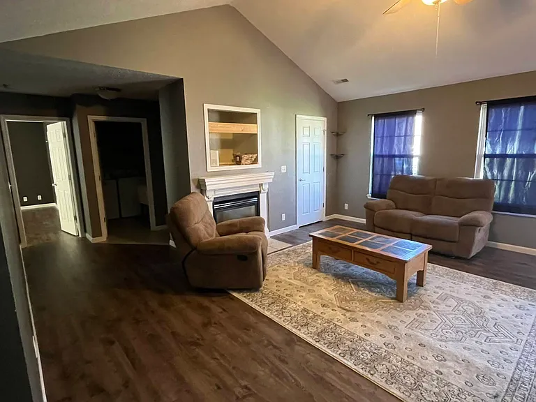 Living room from Dining Room. Left door is Master Bedroom, Middle Door is Laundry, Right door is small closet.