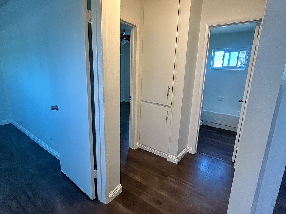 Doors to bedrooms with wall storage