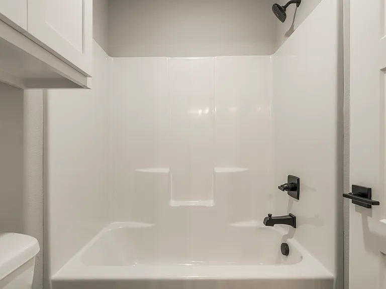 Jack and Jill bathroom has separate area for tub/shower combo with toilet