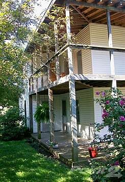 The way they used to make them! A wrap around covered front porch on the main level and also off the