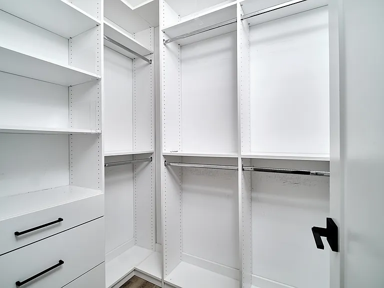 Custom closet in primary bedroom
