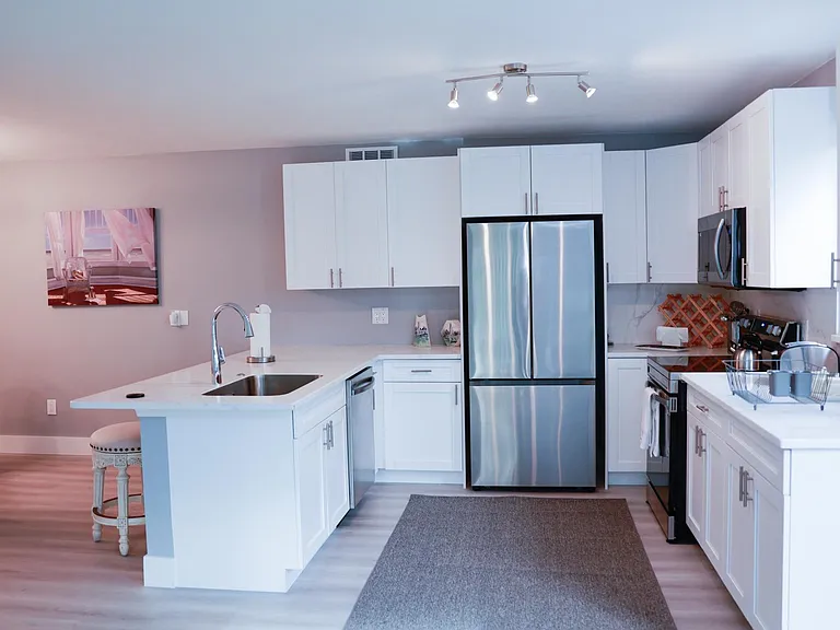 Large open kitchen with new stainless steel appliances