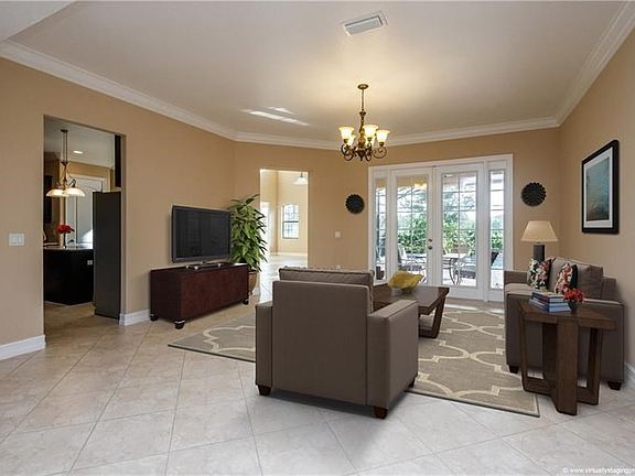 Formal Living Room or gathering space overlooking pool from French doors