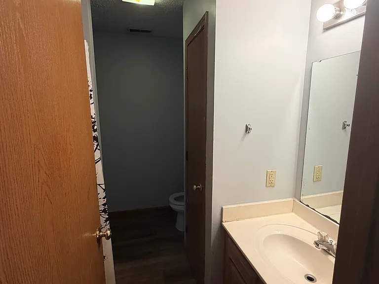 View of the 2nd bathroom from the hallway connected to the 2nd bedroom